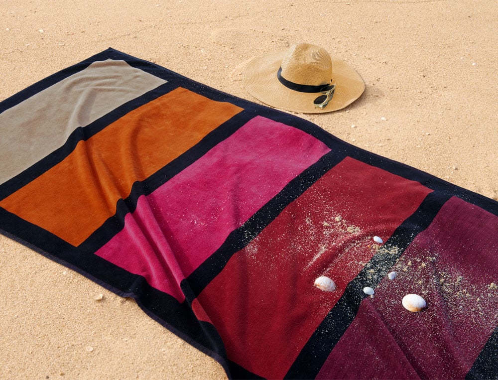 /fr/la-deco/plein-air/draps-de-plage/drap-de-plage-rayures-le-sable-chaud/
